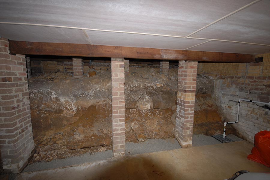 partially exposed house foundations